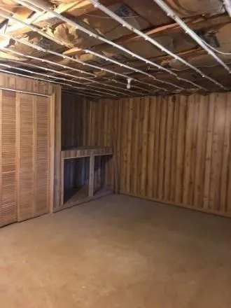 a view of a bench in front of house