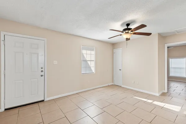 a view of an empty room with a window