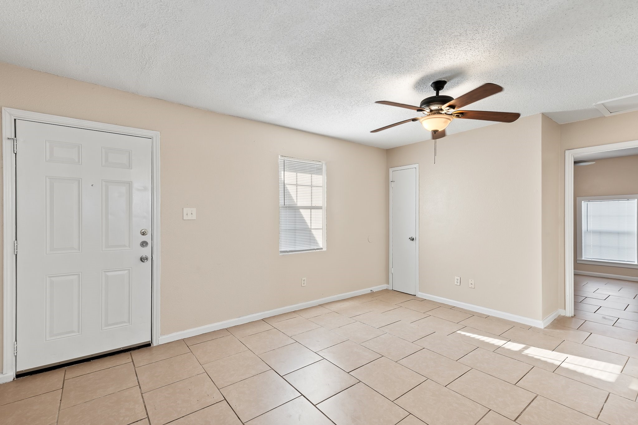410 Old Thorndale Road, Unit A Taylor, TX 76574 - Photo 11 of 28 a view of an empty room with a window