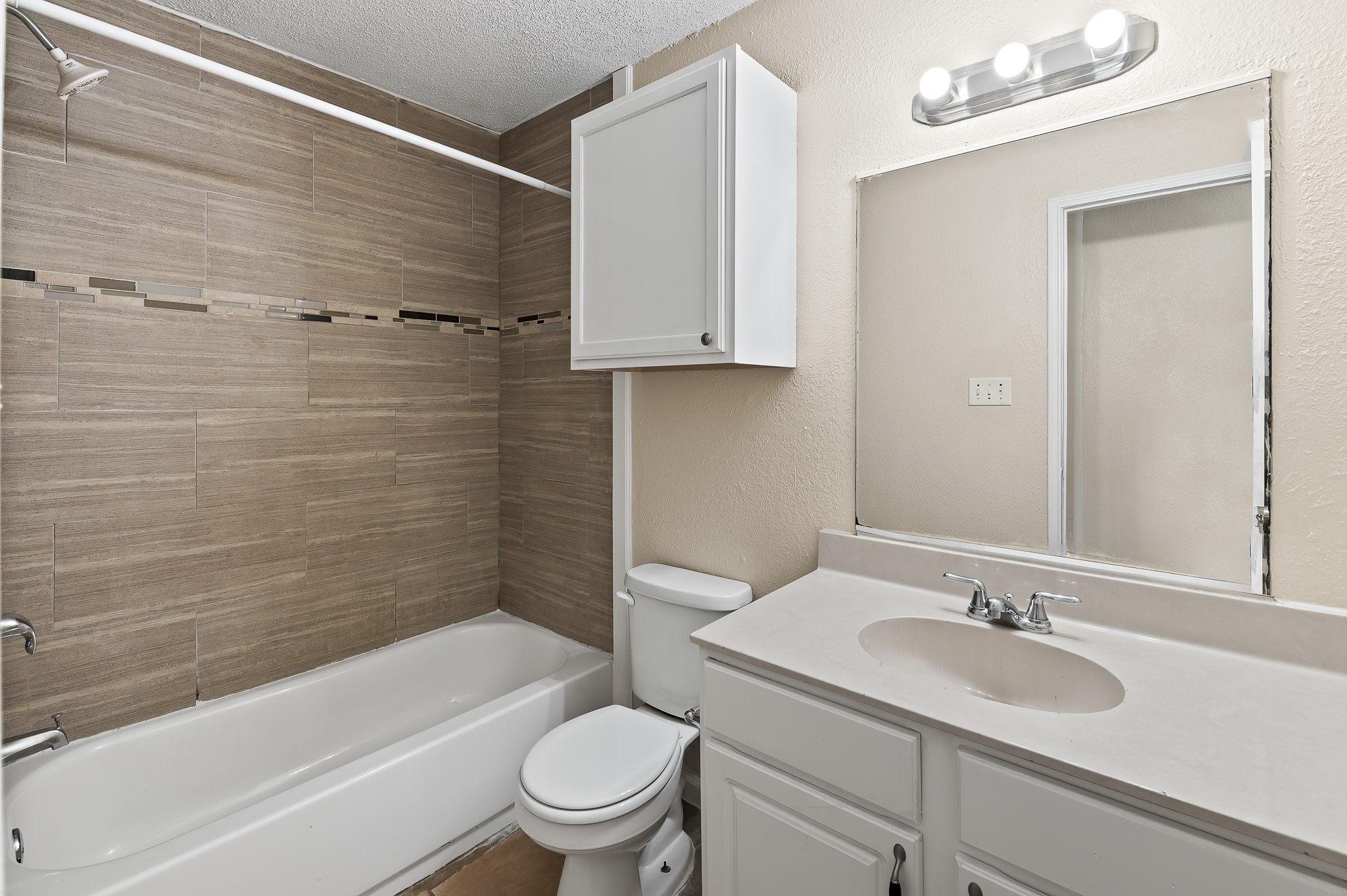 410 Old Thorndale Road, Unit A Taylor, TX 76574 - Photo 24 of 28 a bathroom with a sink toilet and shower