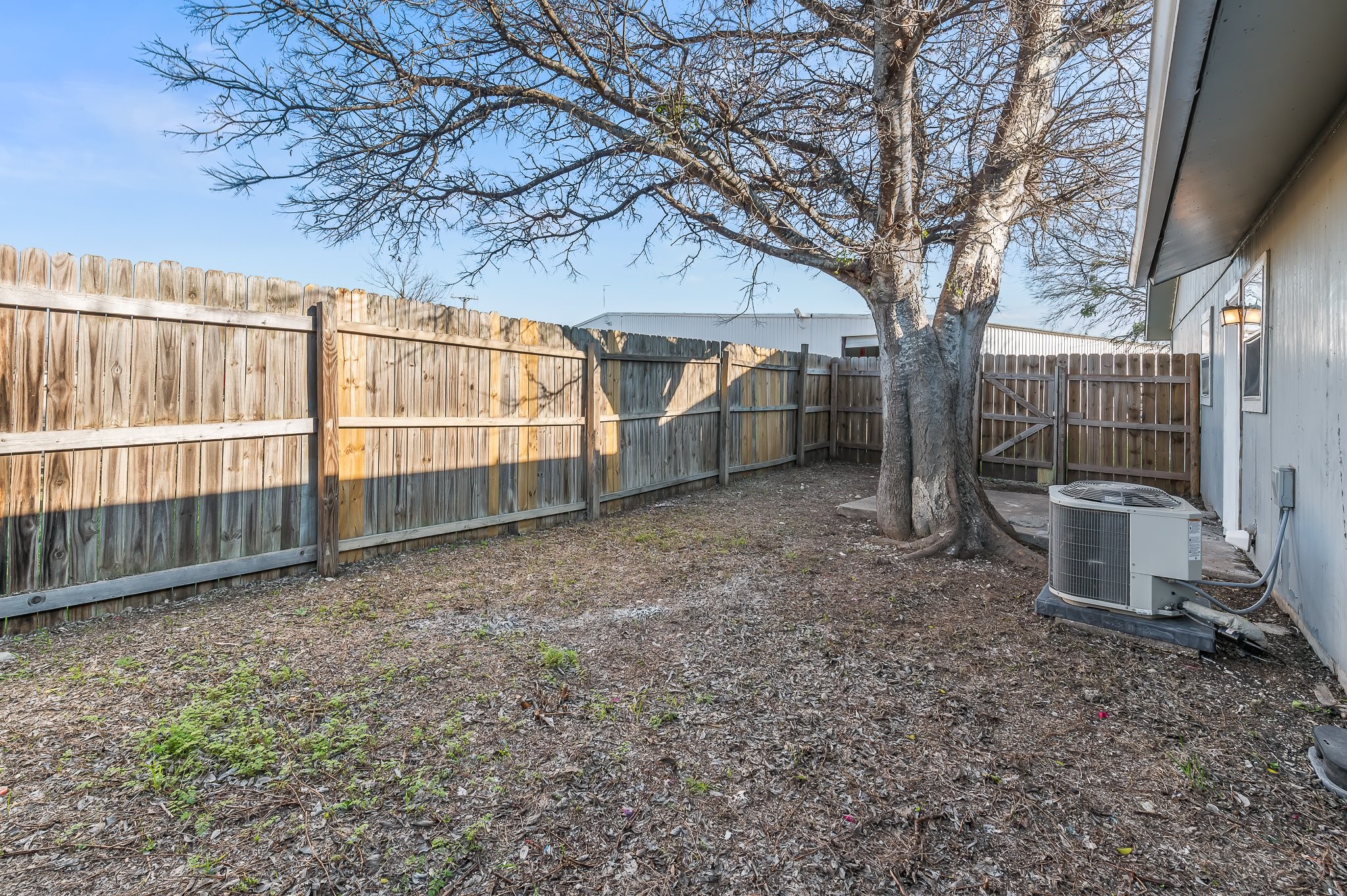 410 Old Thorndale Road, Unit A Taylor, TX 76574 - Photo 28 of 28 a view of a backyard with large trees and a barn