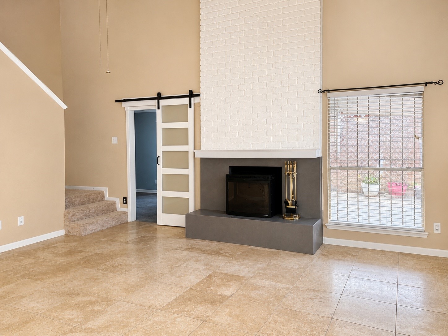 11331 Oakcenter Drive Houston, TX 77072 - Photo 11 of 36 a view of an empty room with a fireplace and a window