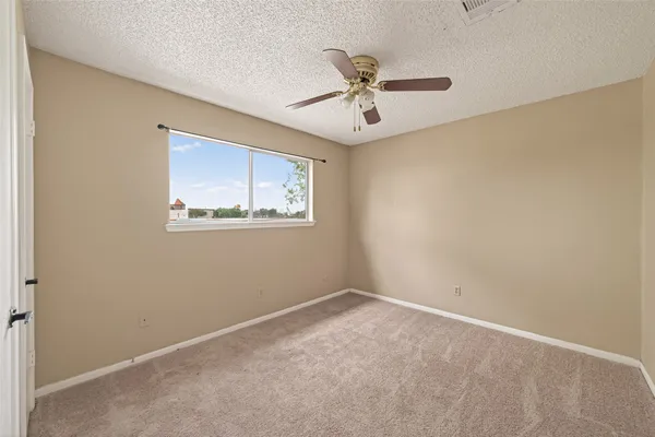 a bathroom with a shower and a toilet