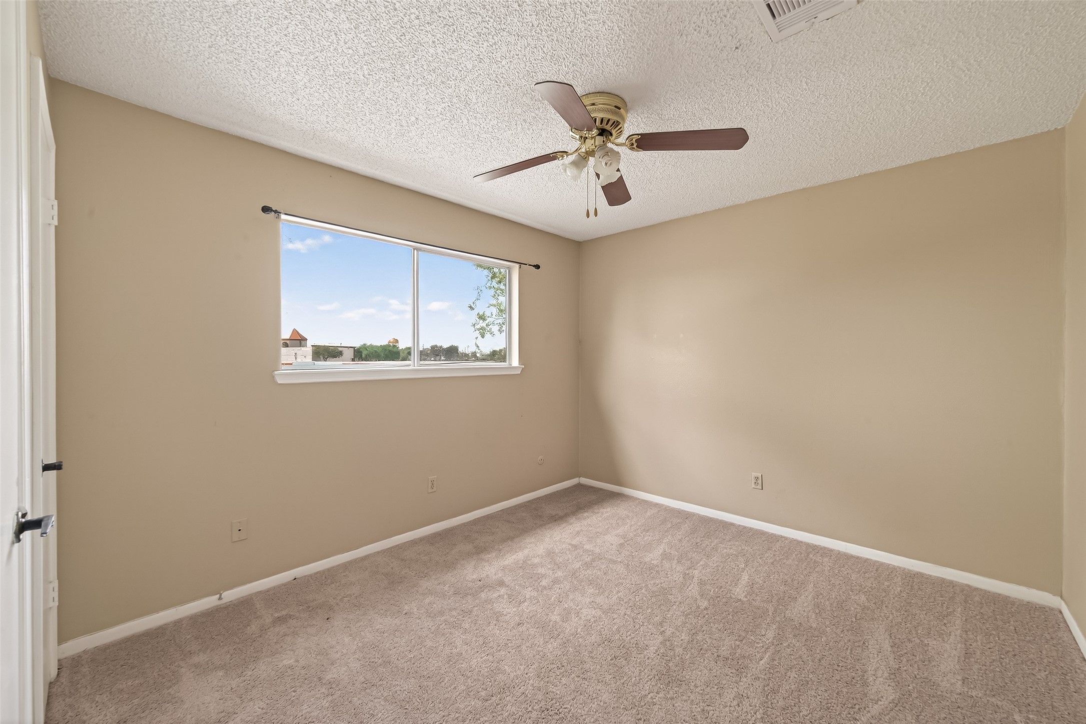 11331 Oakcenter Drive Houston, TX 77072 - Photo 18 of 36 a view of a big room with wooden floor and windows