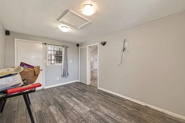 a bathroom with a granite countertop shower a sink and a mirror