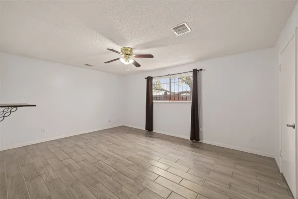 a view of a backyard of the house