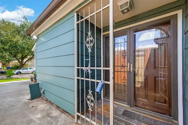 a view of an empty room with a fireplace and a window