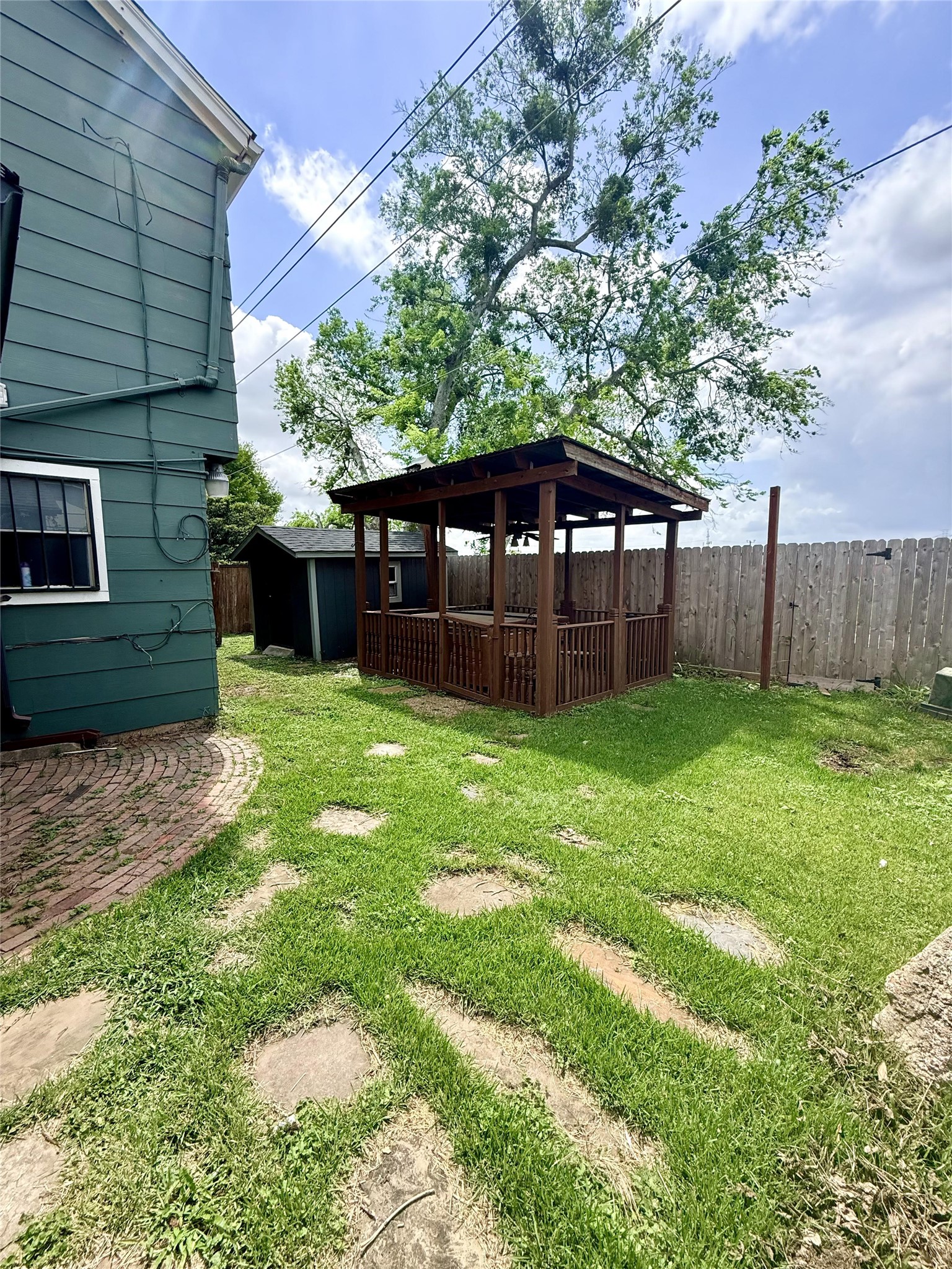 11331 Oakcenter Drive Houston, TX 77072 - Photo 32 of 36 a view of a backyard with a small cabin