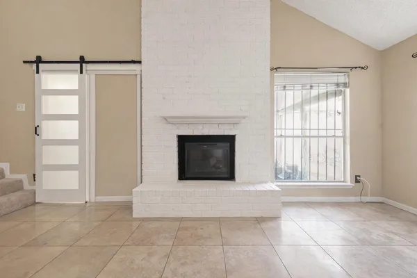 a kitchen with stainless steel appliances granite countertop a stove refrigerator sink and cabinets