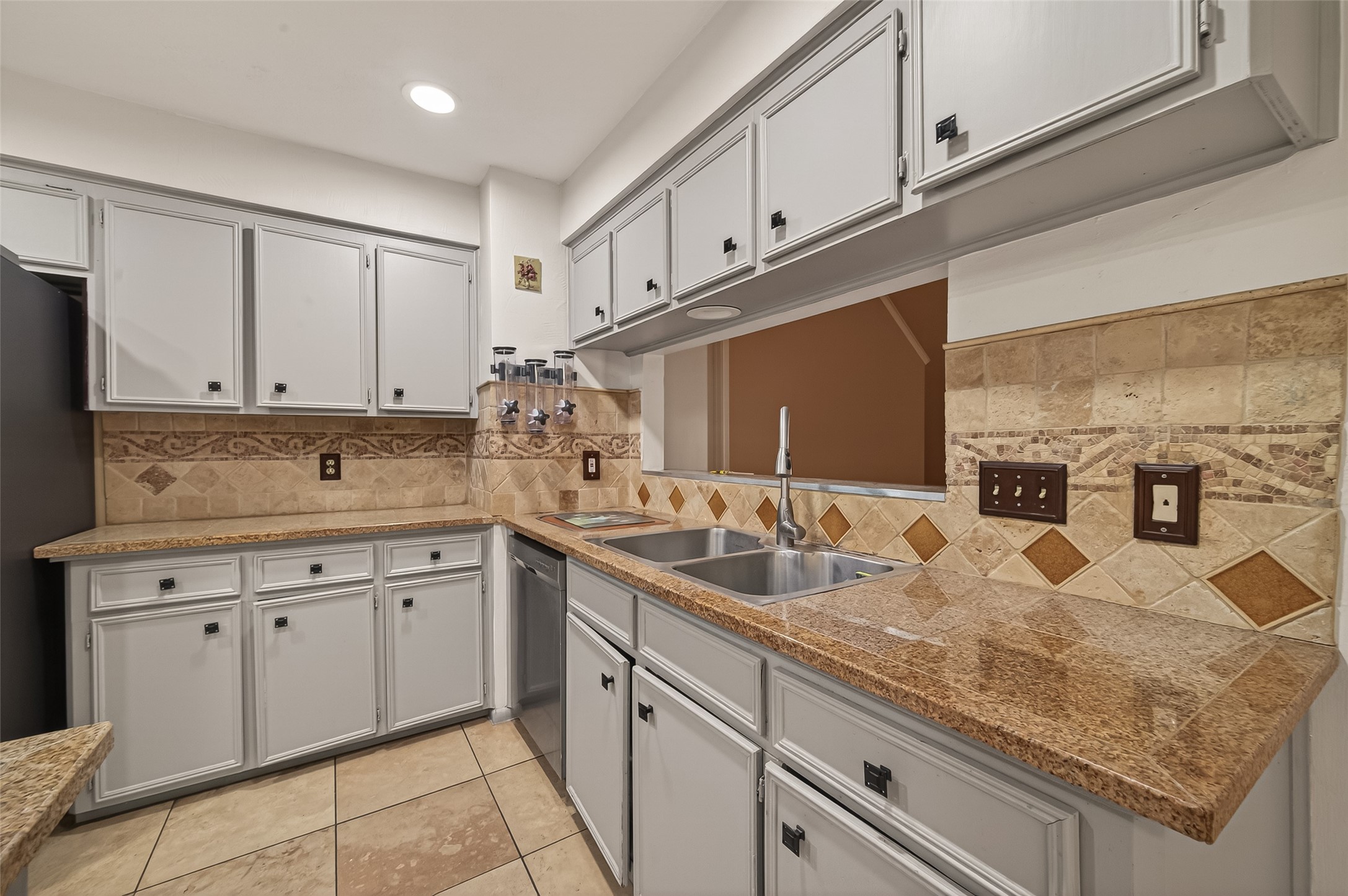 11331 Oakcenter Drive Houston, TX 77072 - Photo 6 of 36 a kitchen with stainless steel appliances granite countertop a sink and cabinets