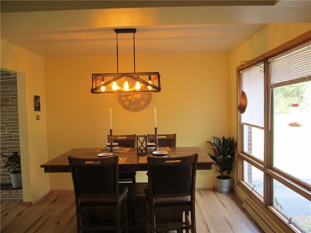 4717 Ellwood Road New Castle, PA 16101 - Photo 11 of 32 a view of a dining room with furniture window and wooden floor