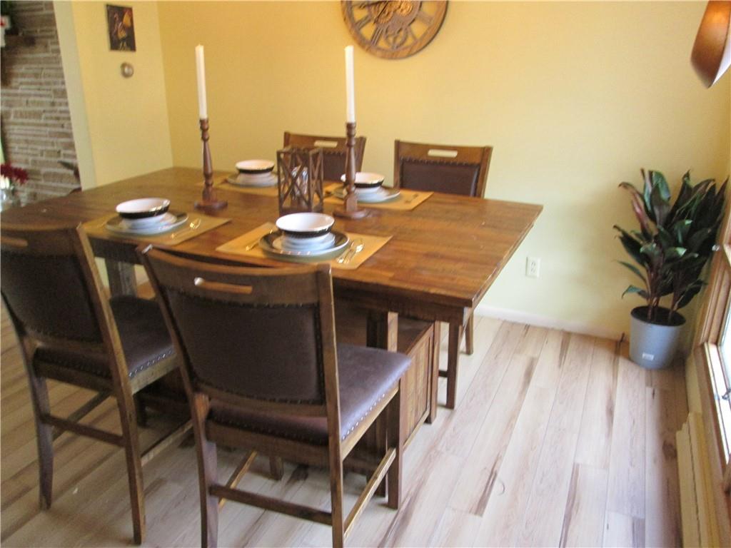4717 Ellwood Road New Castle, PA 16101 - Photo 13 of 32 a view of a dining room with furniture and wooden floor