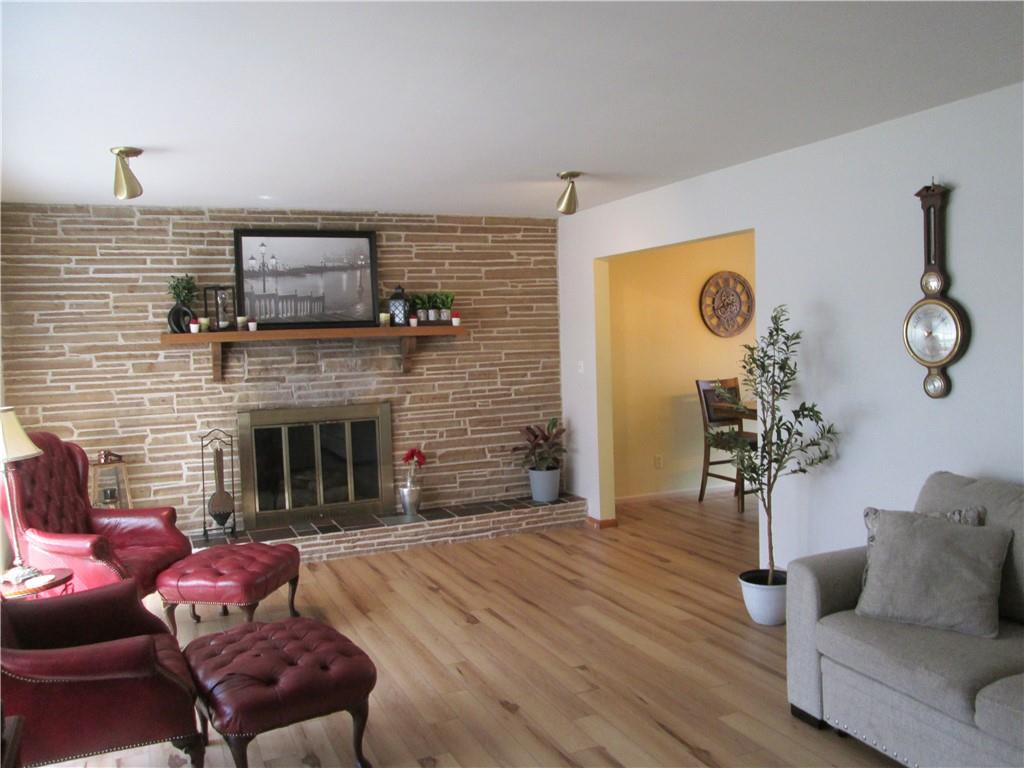 4717 Ellwood Road New Castle, PA 16101 - Photo 14 of 32 a living room with furniture and a fireplace