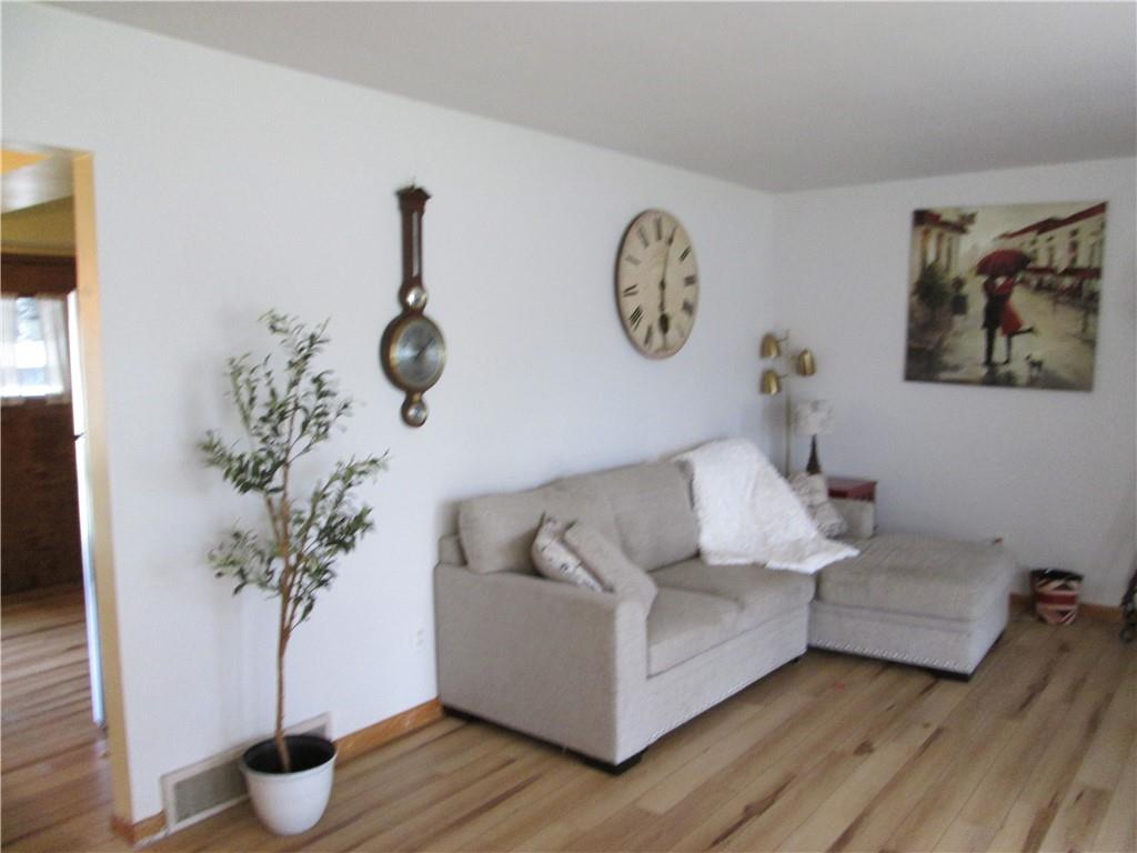 4717 Ellwood Road New Castle, PA 16101 - Photo 15 of 32 a living room with furniture and a potted plant