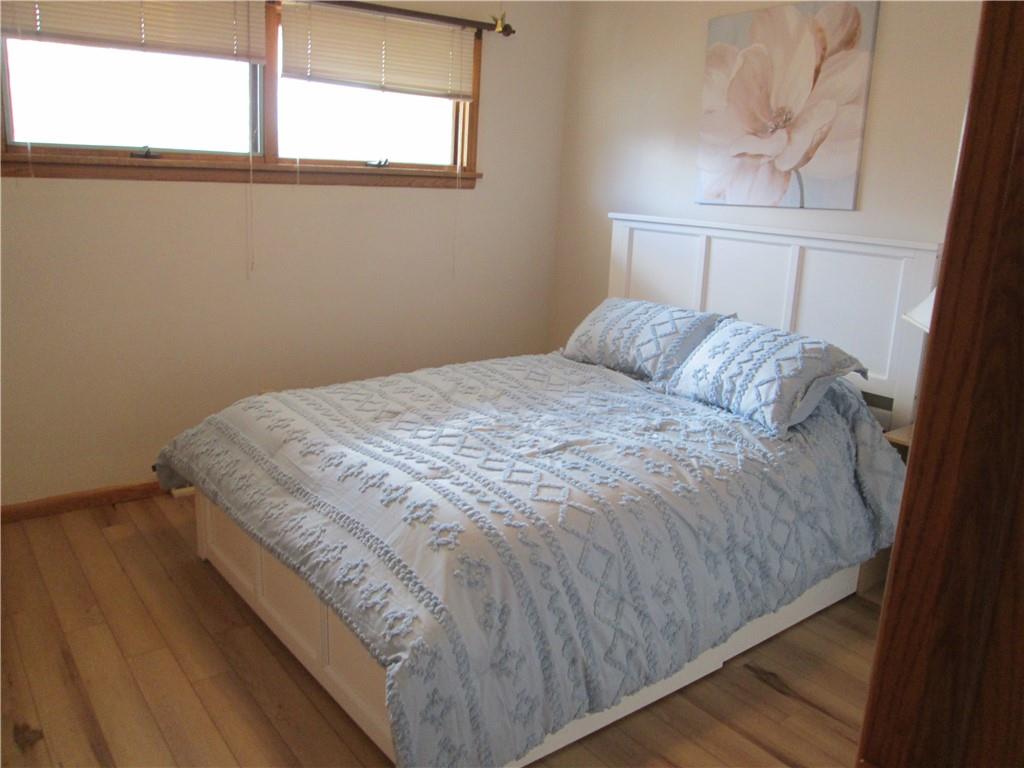 4717 Ellwood Road New Castle, PA 16101 - Photo 17 of 32 a bed sitting in a bedroom next to a window