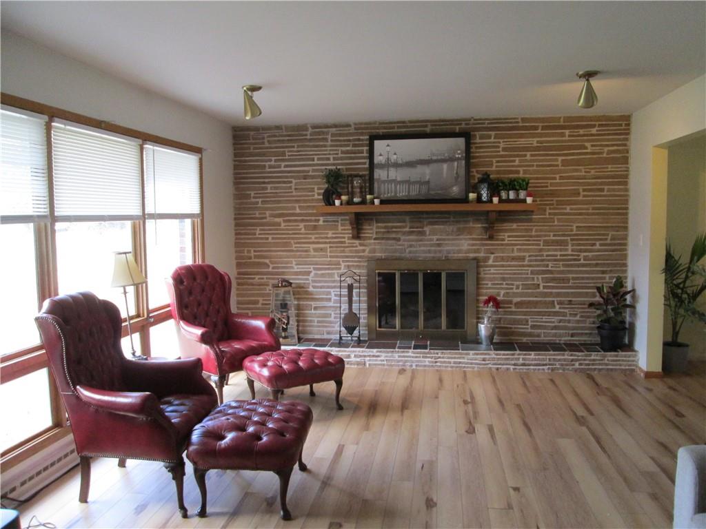 4717 Ellwood Road New Castle, PA 16101 - Photo 18 of 32 a living room with furniture and a fireplace