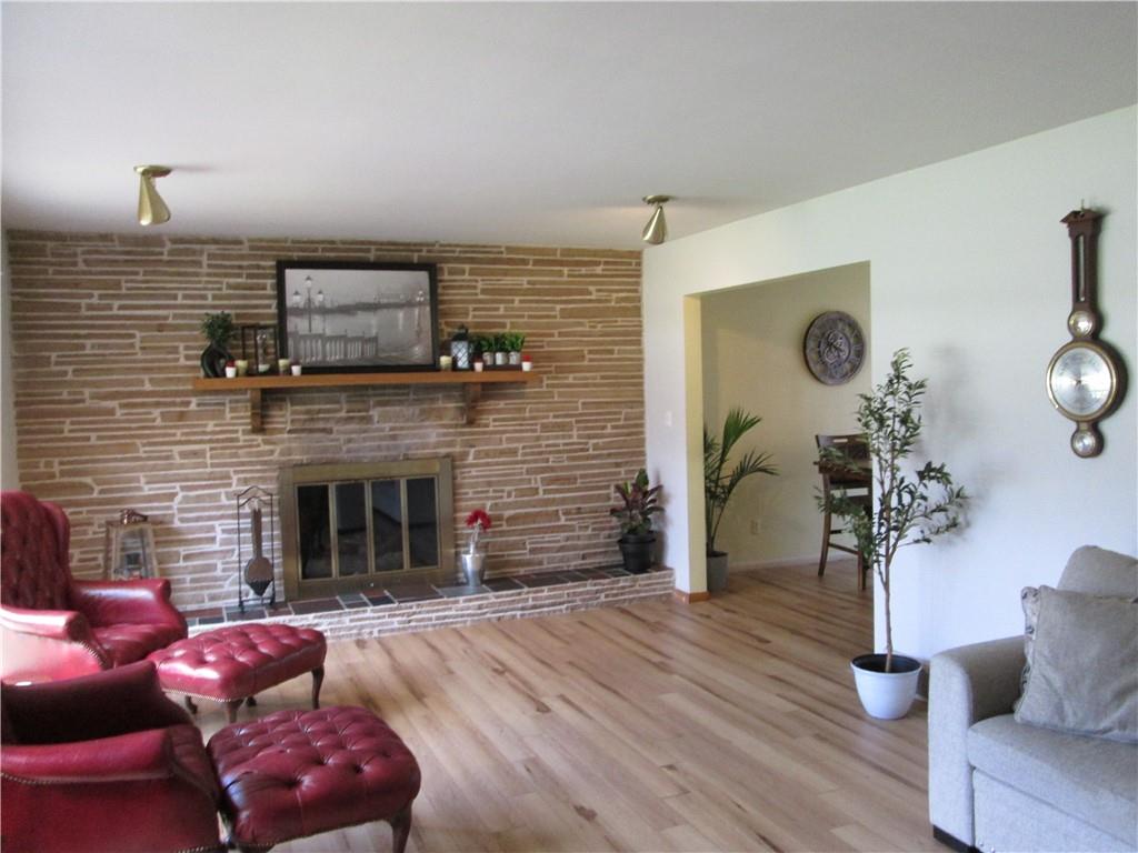 4717 Ellwood Road New Castle, PA 16101 - Photo 19 of 32 a living room with furniture and a fireplace