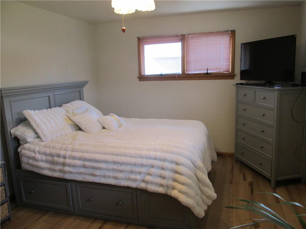 4717 Ellwood Road New Castle, PA 16101 - Photo 23 of 32 a bedroom with a bed and a flat screen tv