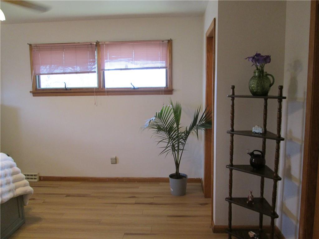 4717 Ellwood Road New Castle, PA 16101 - Photo 25 of 32 a view of a room that has a potted plant and wooden floor