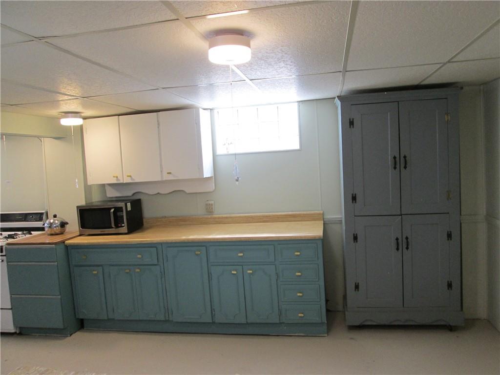4717 Ellwood Road New Castle, PA 16101 - Photo 28 of 32 a kitchen with stainless steel appliances granite countertop a refrigerator and a stove top oven