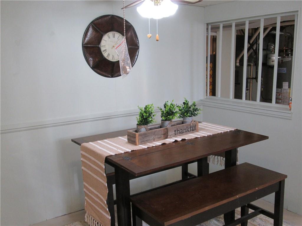 4717 Ellwood Road New Castle, PA 16101 - Photo 30 of 32 a view of a dining room with furniture and wooden floor