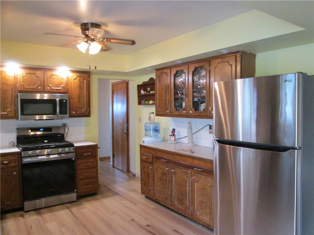 4717 Ellwood Road New Castle, PA 16101 - Photo 7 of 32 a kitchen with stainless steel appliances a refrigerator stove and sink