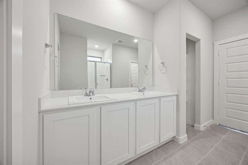 316 Millwood Road Lavon, TX 75166 - Photo 21 of 37 Primary Bathroom in the Oak II home plan by Trophy Signature Homes – REPRESENTATIVE PHOTO