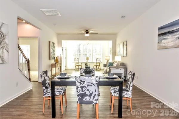 a view of a dining room with furniture and window