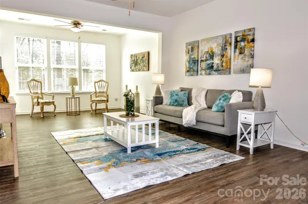 a living room with furniture and a table