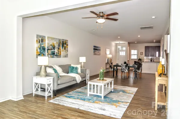 a living room with furniture and a table