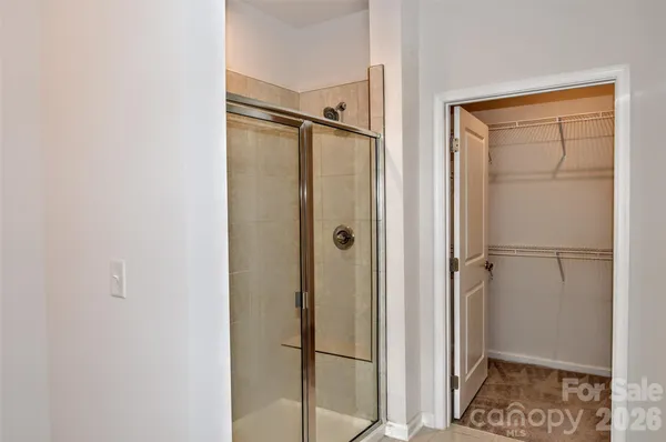 a bathroom with a glass door shower