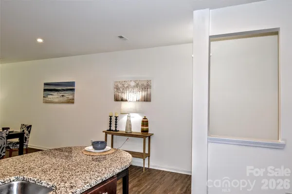 a bedroom with a table and chairs