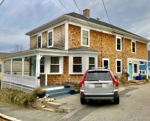a car parked in front of a house