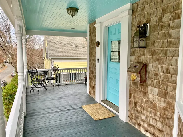 a view of a balcony with chairs