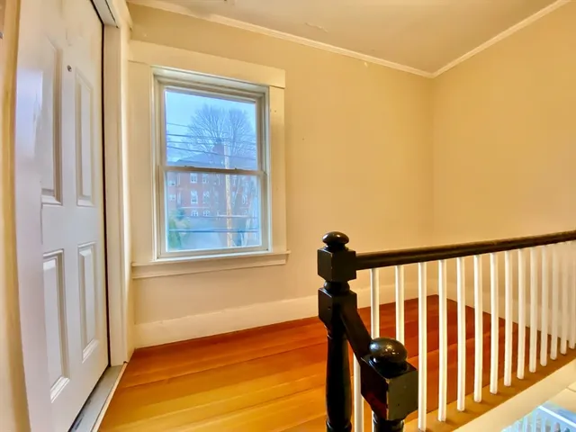 a view of entryway with wooden floor