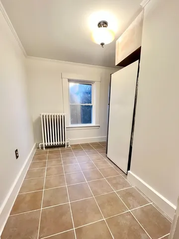 a view of a hallway with washer and dryer