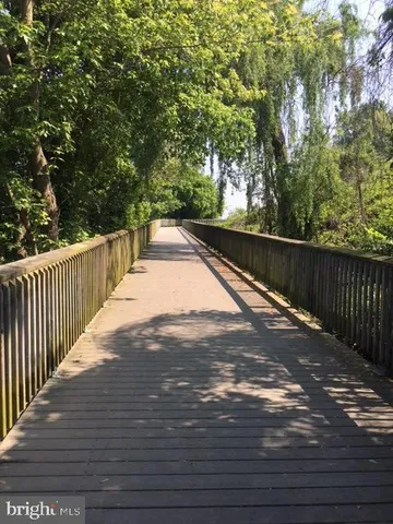 a view of balcony with wooden floor
