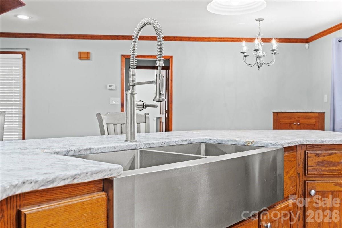 1935 Oakland Church Road Chesterfield, SC 29709 - Photo 16 of 48 a utility room with stainless steel appliances granite countertop a sink and a refrigerator