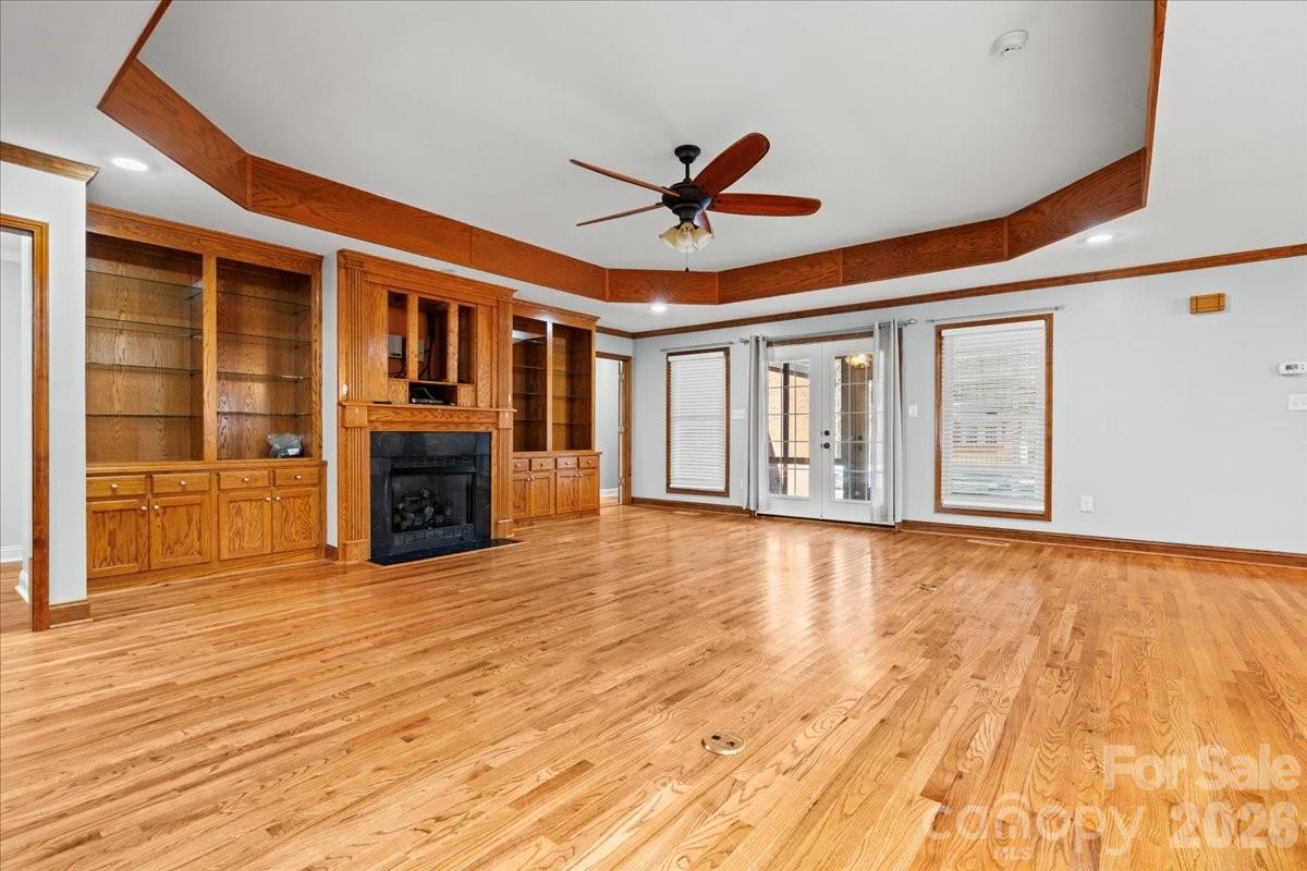 1935 Oakland Church Road Chesterfield, SC 29709 - Photo 20 of 48 a view of an empty room with a fireplace and wooden floor