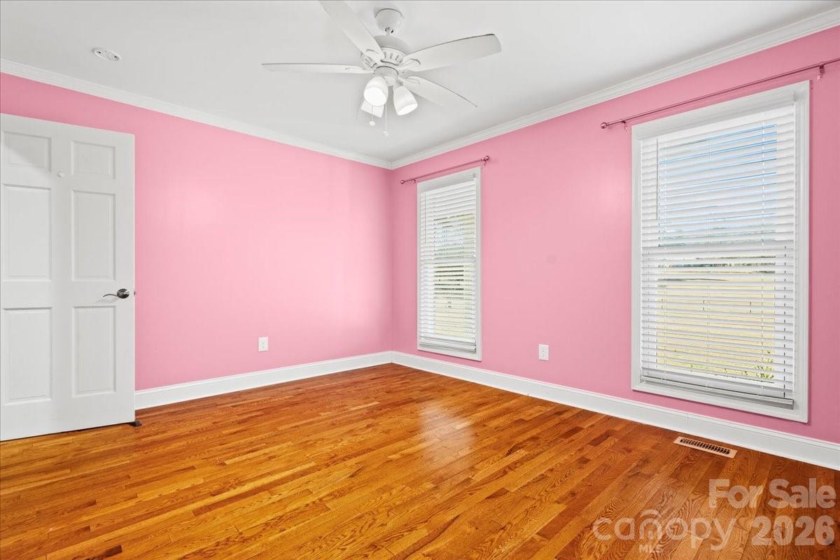 1935 Oakland Church Road Chesterfield, SC 29709 - Photo 24 of 48 a view of an empty room with window and chandelier fan