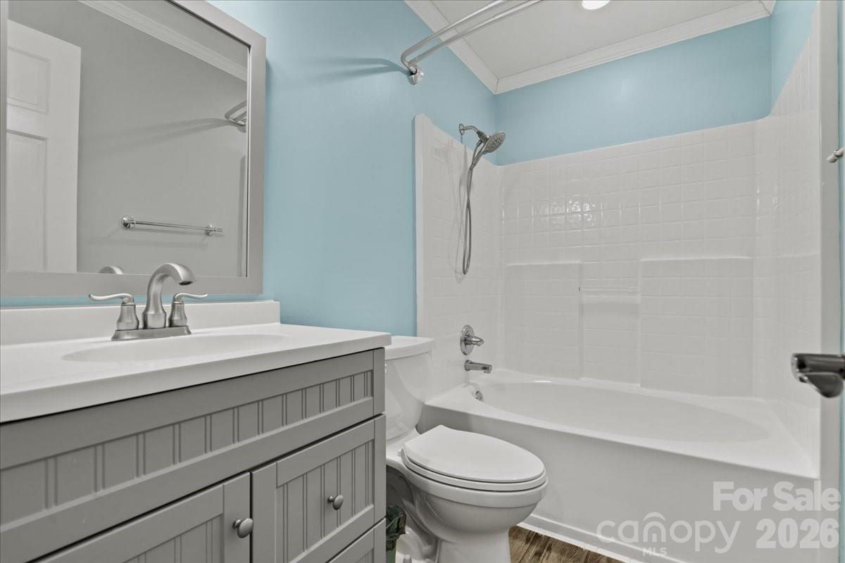 1935 Oakland Church Road Chesterfield, SC 29709 - Photo 27 of 48 a bathroom with a sink toilet vanity and shower