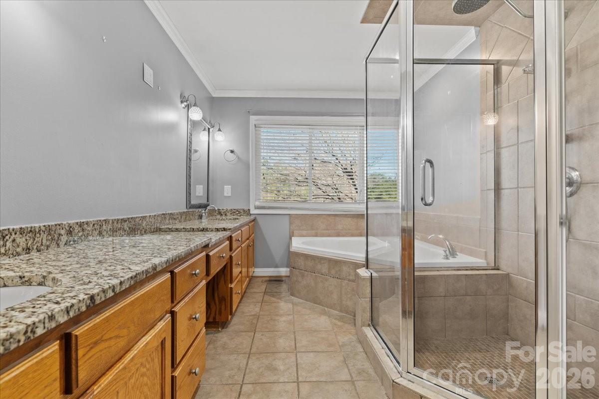 1935 Oakland Church Road Chesterfield, SC 29709 - Photo 34 of 48 a bathroom with a granite countertop sink a mirror and a shower