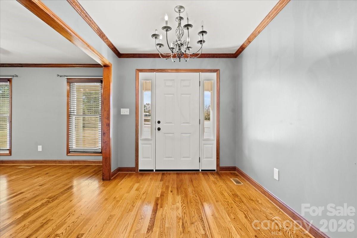 1935 Oakland Church Road Chesterfield, SC 29709 - Photo 9 of 48 wooden floor in an empty room with a window