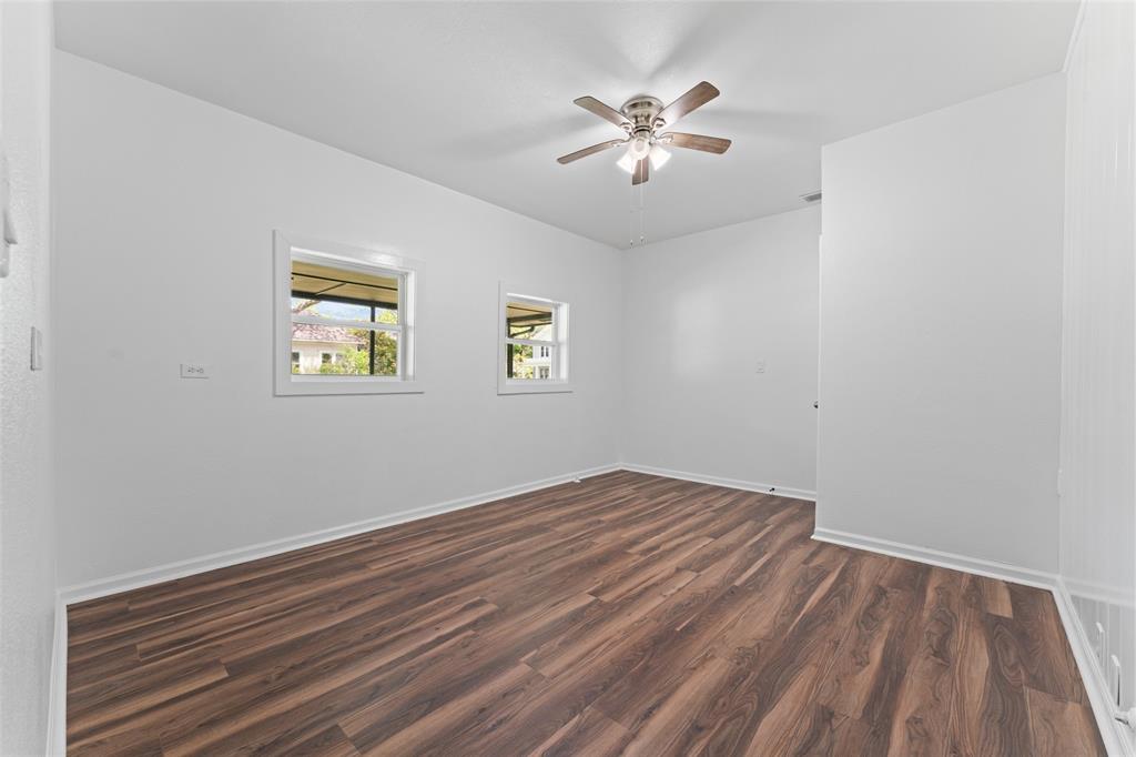2405 Monroe Street Commerce, TX 75428 - Photo 24 of 31 a view of empty room with wooden floor and fan