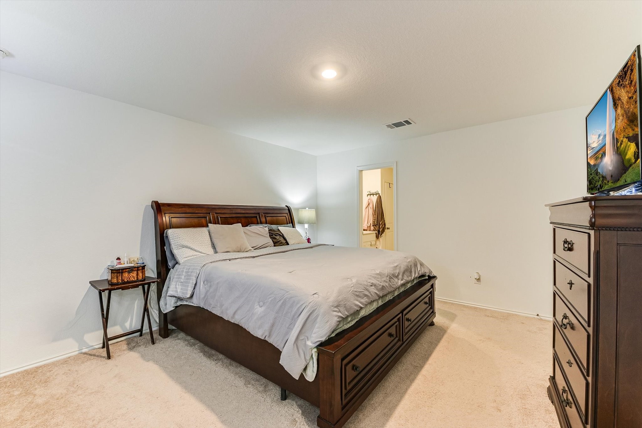 2223 Cumulus Court Lockhart, TX 78644 - Photo 12 of 20 a bedroom with a bed and a flat screen tv