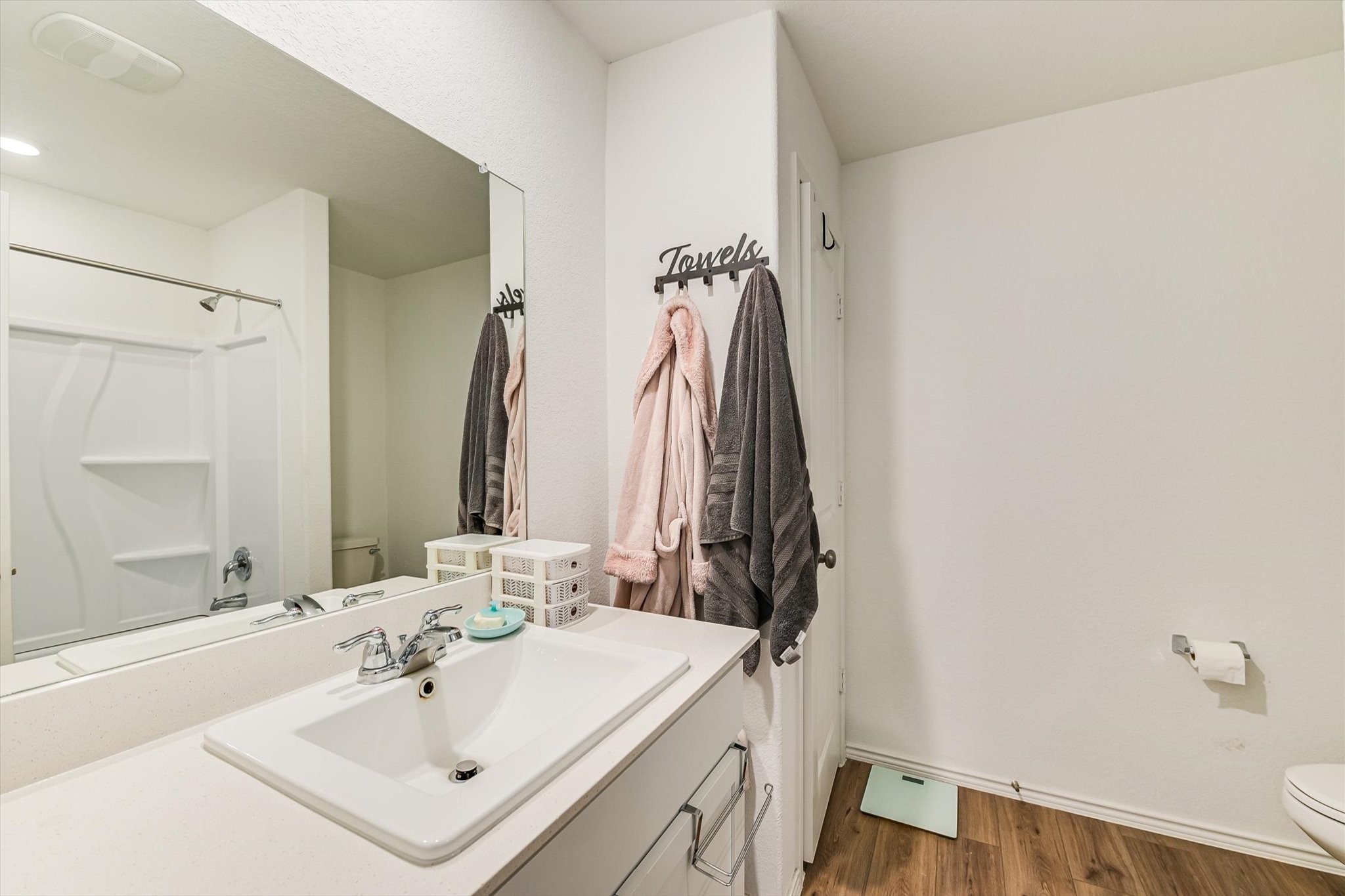 2223 Cumulus Court Lockhart, TX 78644 - Photo 13 of 20 a bathroom with a sink and a mirror
