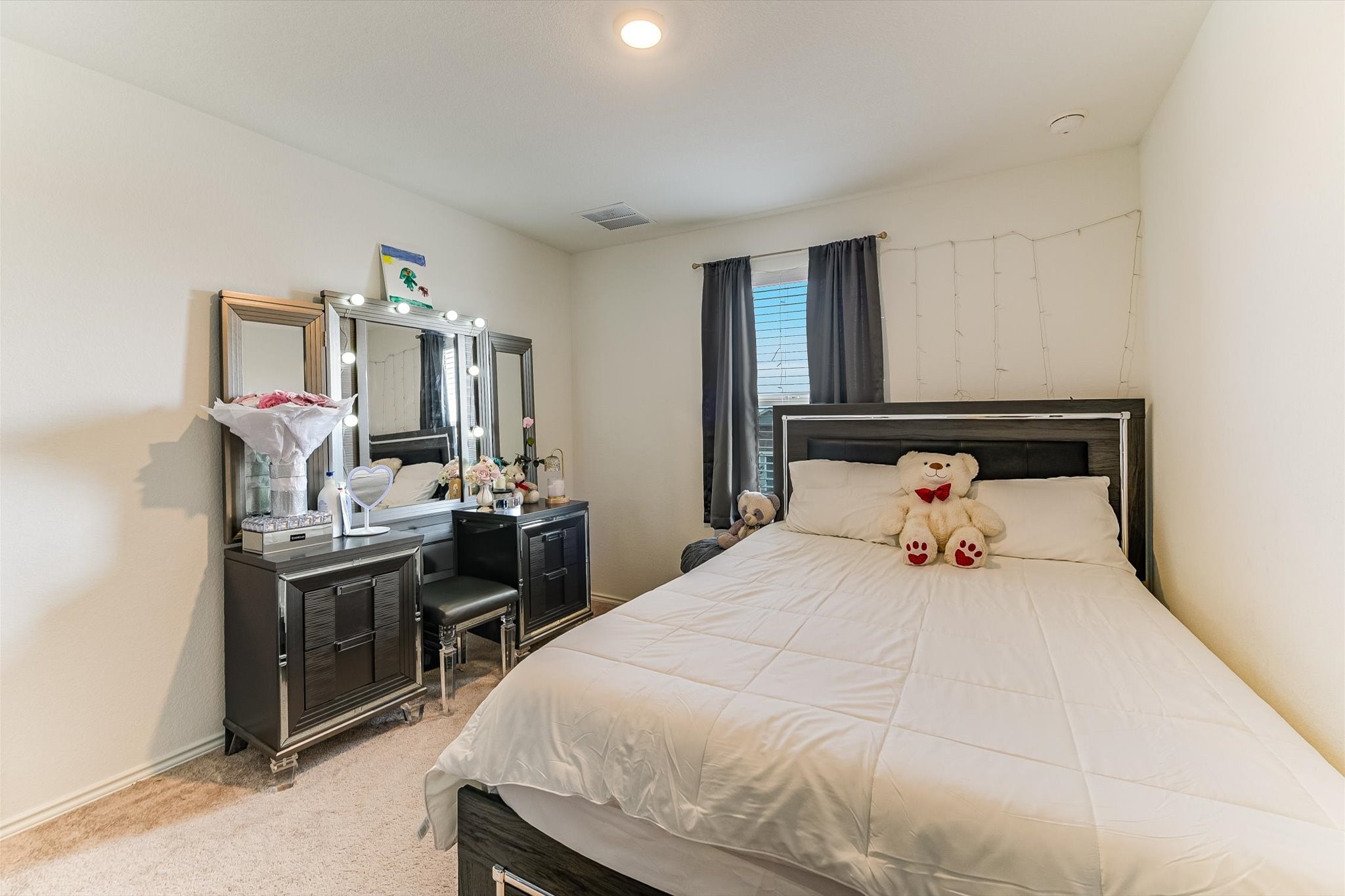 2223 Cumulus Court Lockhart, TX 78644 - Photo 17 of 20 a bedroom with a bed and flat screen tv