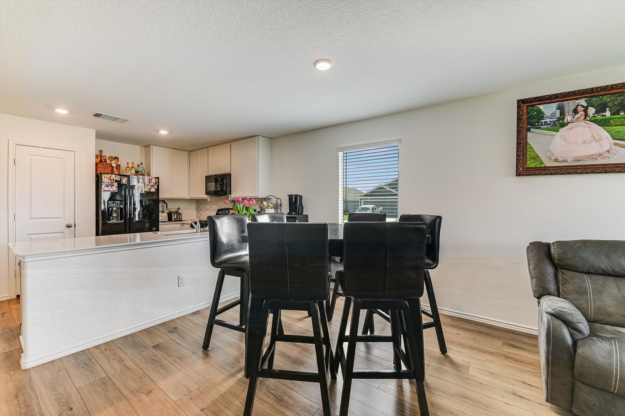 2223 Cumulus Court Lockhart, TX 78644 - Photo 7 of 20 a view of a dining room with furniture and wooden floor