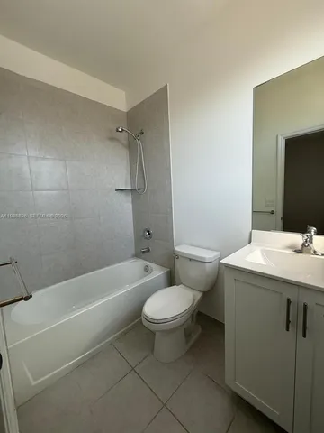 a bathroom with a sink a toilet and a bathtub