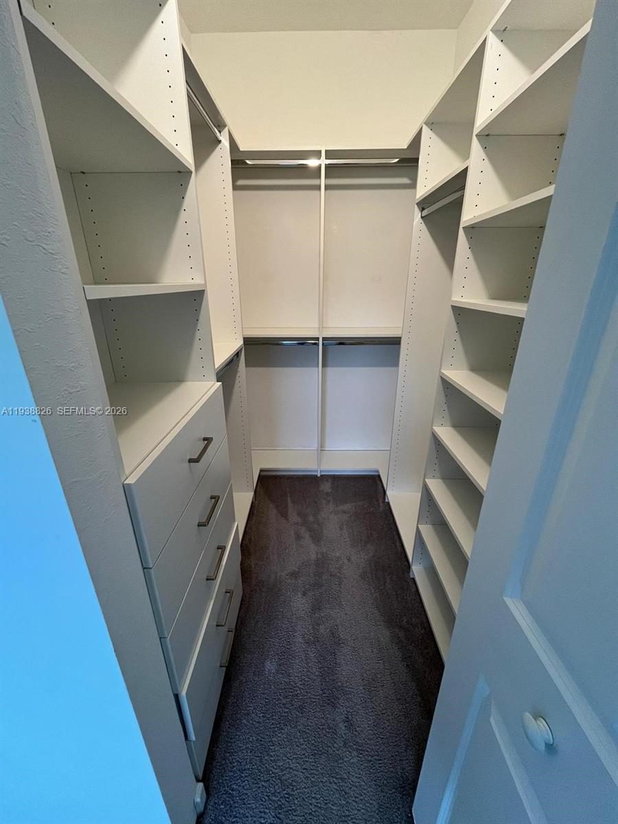 9941 Southwest 228th Terrace, Unit 9941 Miami, FL 33190 - Photo 16 of 31 a view of walk in closet